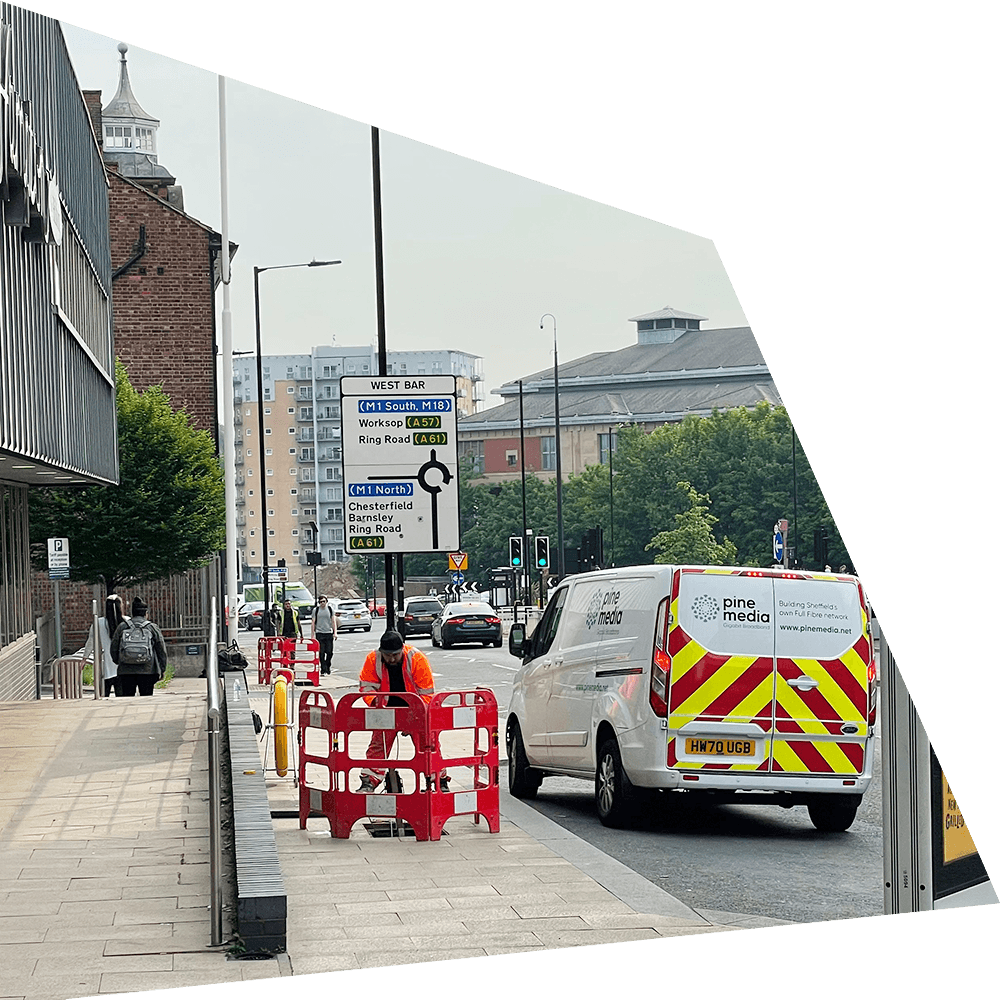 Pine Media engineers pulling fibre cable