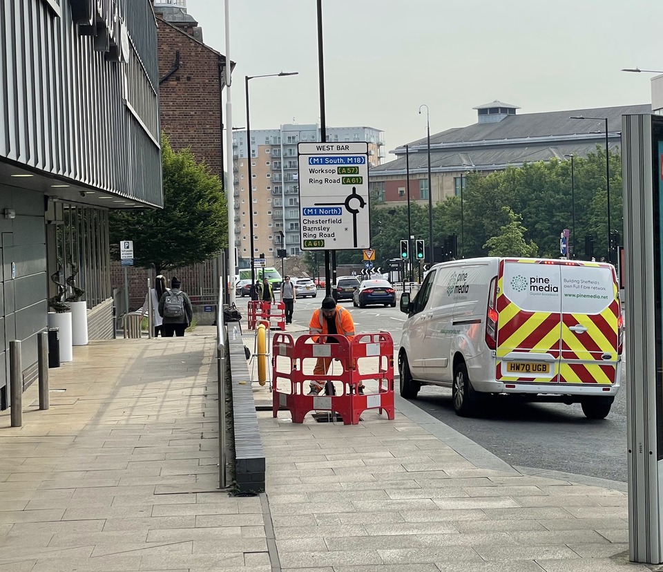 Engineer pulling fibre at West Bar in Sheffield